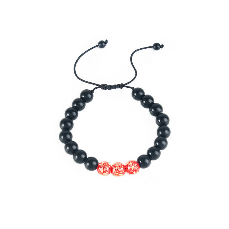 Armband Schwarzer Obsidian mit roten Perlen elastisch verstellbar