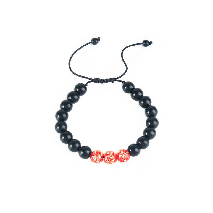 Armband Schwarzer Obsidian mit roten Perlen elastisch verstellbar