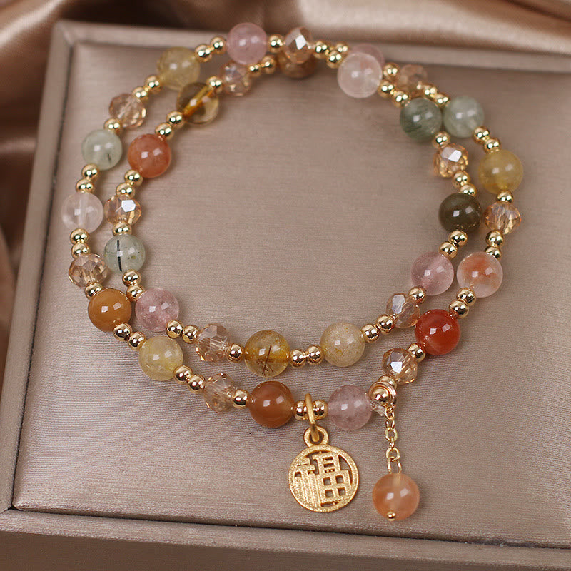 Armband Fu-Zeichen mit Natursteinen und goldenen Perlen Charm.