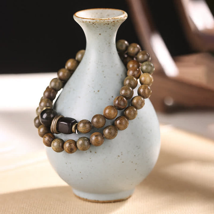 Armband Sandelholz Kristall – Frieden braune Perlen Keramik Vase