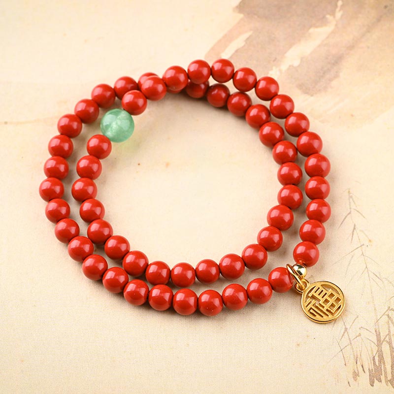 Rotes Perlenarmband mit grünem Aventurin Anhänger Glück Energie