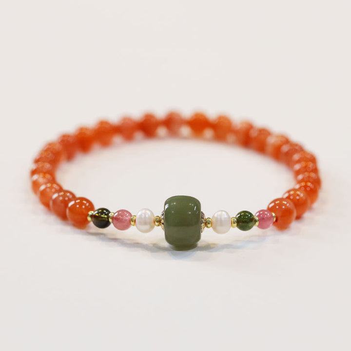 Armband Roter Achat Jade Ruhe elastisches Naturstein Perlenarmband getragen