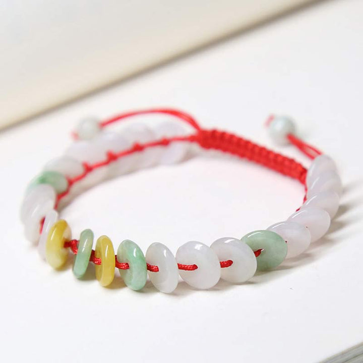 Jade Armband mit weißen und grünen Steinen rotes Textilband