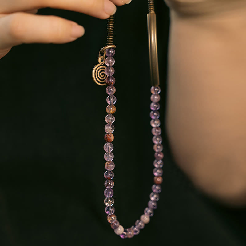Amethyst Armband Kupfer – Liebe mit Spiralanhänger Hand getragen