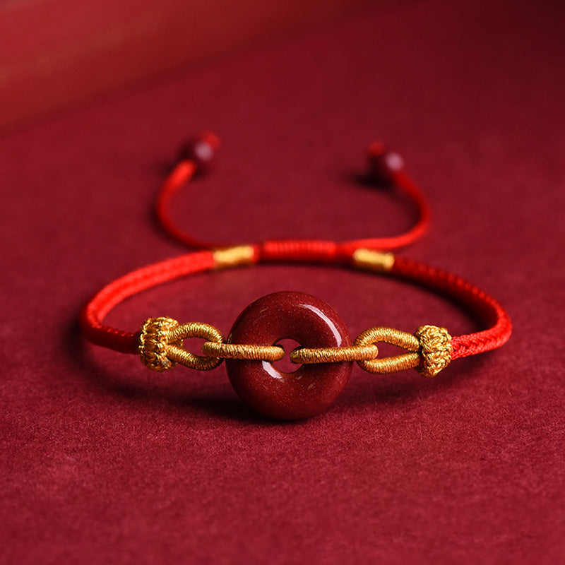 Armband Zinnober – Frieden & Segen Energie rotes Armband goldene Verzierungen
