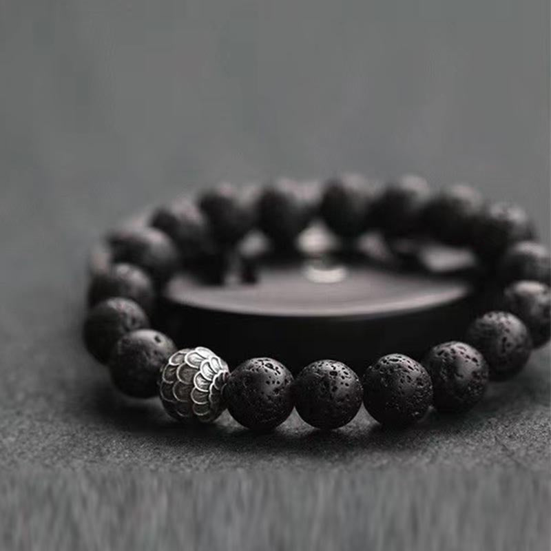 Armband Lavastein – Heilung schwarze Perlen mit Metallakzent elastisch