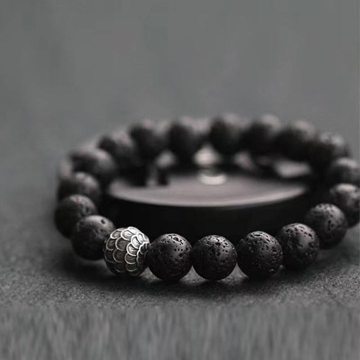 Armband Lavastein – Heilung schwarze Perlen mit Metallakzent elastisch