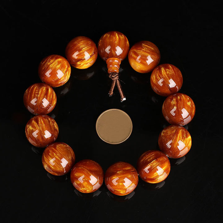 Mala – Erfolg Armband aus braunem Holz mit Perlen und Quaste