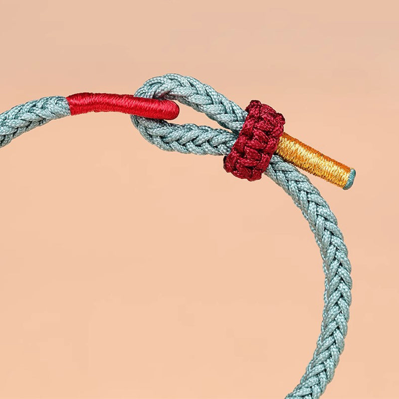Armband – Glück & Stärke & Balance türkis rot gold geflochten Knoten