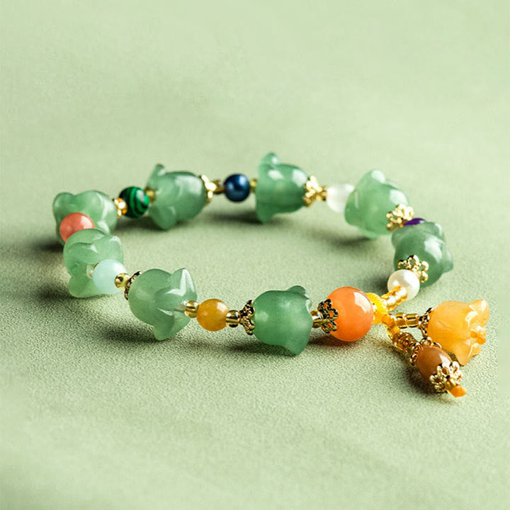 Armband Grüner Aventurin mit orangenen Perlen und goldenen Verschlüssen elegant.