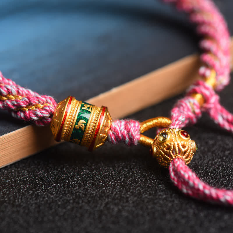 Tibetisches Gebets-Armband mit goldenen Perlen rosa Schnur elegant