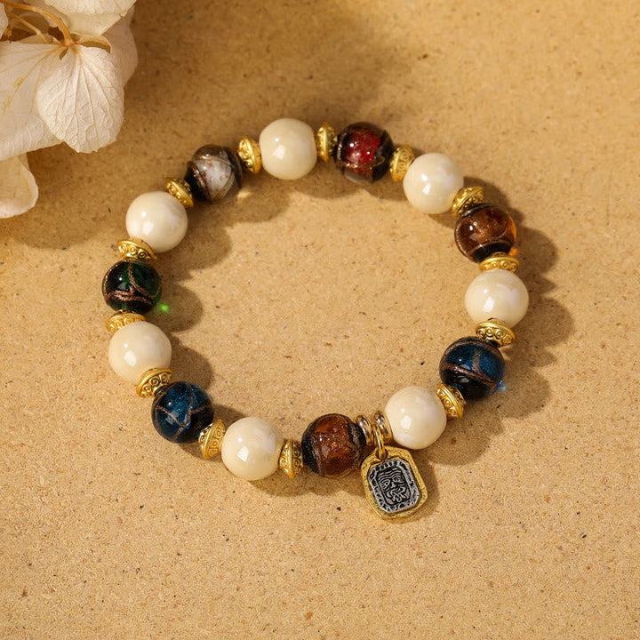 Armband – Schutz & Wohlstand & Balance mit weißen Perlen und Natursteinen elegant.