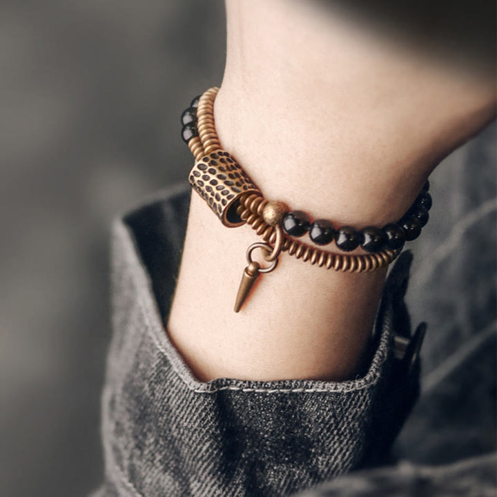 Armband Obsidian Kupfer Heilung Frieden am Handgelenk getragen