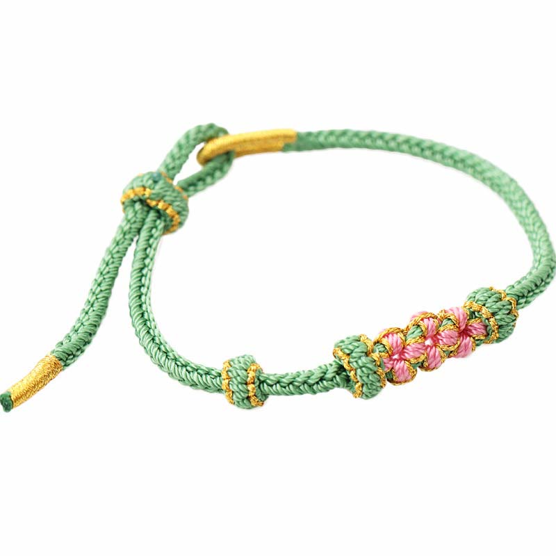 Grünes Armband Pfirsichblüte – Glück mit rosa Blütenperlen elastisch