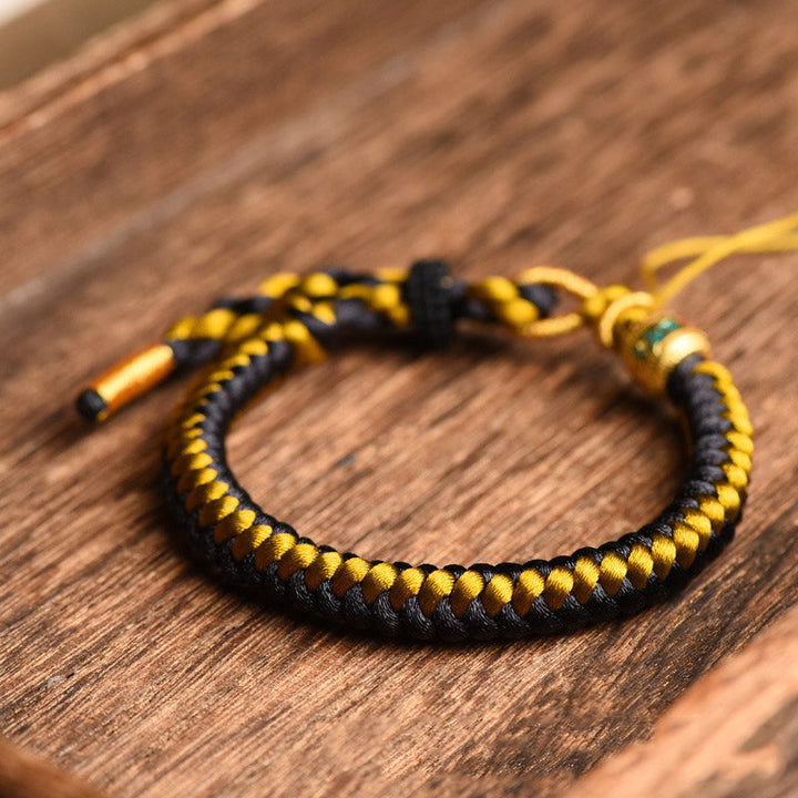 Armband Om Mani Padme Hum Gold schwarzes Seil gelbe Fäden Holz