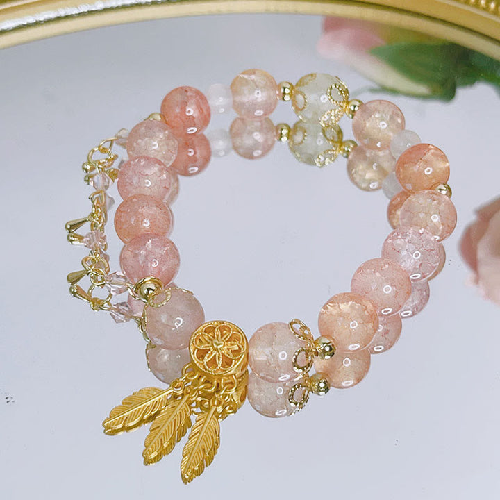 Roségold Perlenarmband mit goldenen Blattanhängern, zartem Design