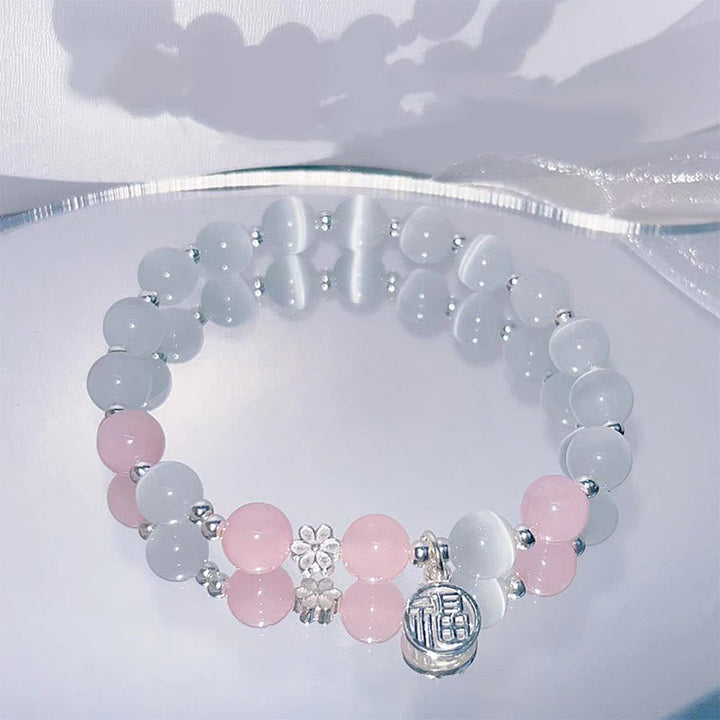 Armband Kristall Pfirsichblüte grau rosa Perlen Silber elegant Schmuck