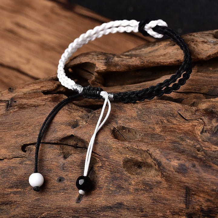 Armband Schwarz Weiß – Heilung mit Perlen und Kordel Design