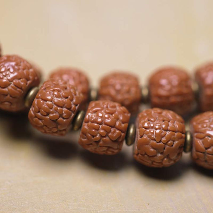 Mala Bodhi Glück Energie Armband mit geschnitzten Holzperlen Metallspacer