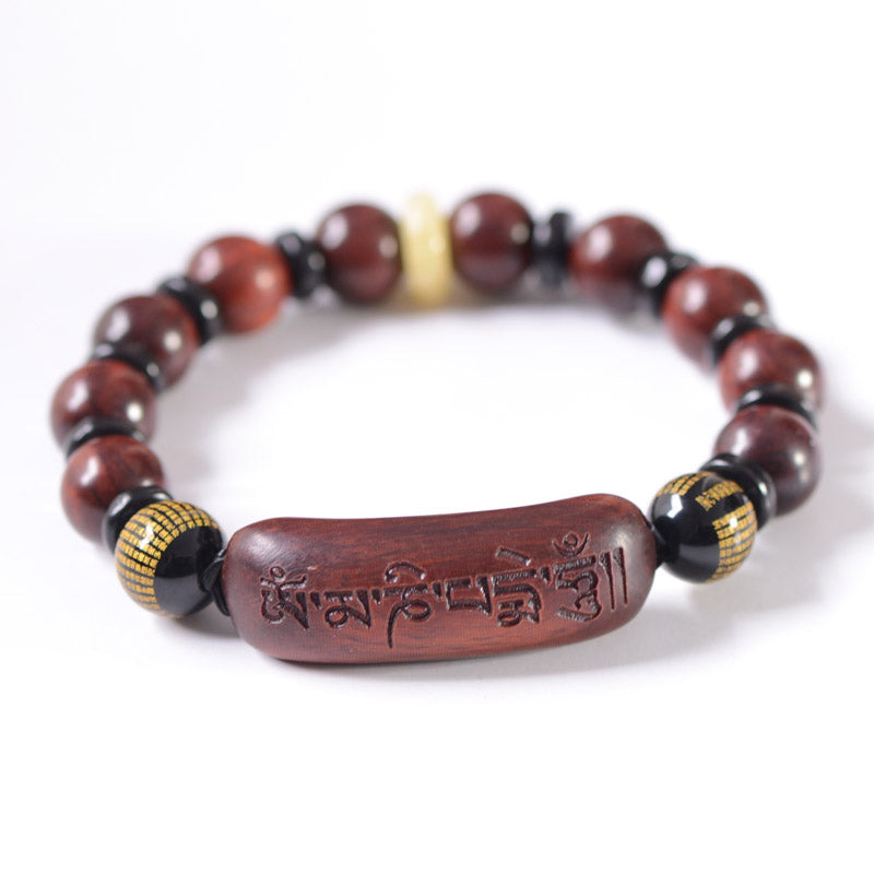 Armband Sandelholz Om Mani Padme Hum mit roten Perlen elastisch.
