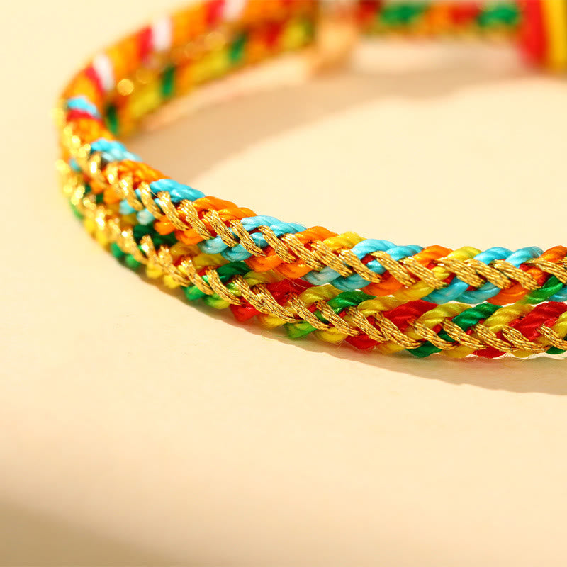 Buntes Zongzi Glück Armband mit goldenem Glanz elastisch geflochten.