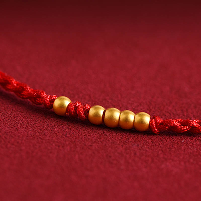 Rotes Seidenarmband mit goldenen Perlen Schutz Glück Paar.