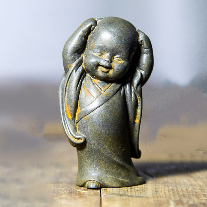 Meditation Buddha Klein Schreibtisch Mönch kratzt sich am Kopf