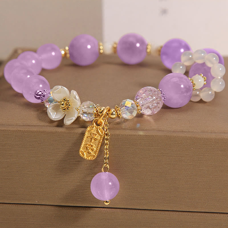 Armband Amethyst Kristall Heilung Segen lila Perlen Goldakzente elegant.