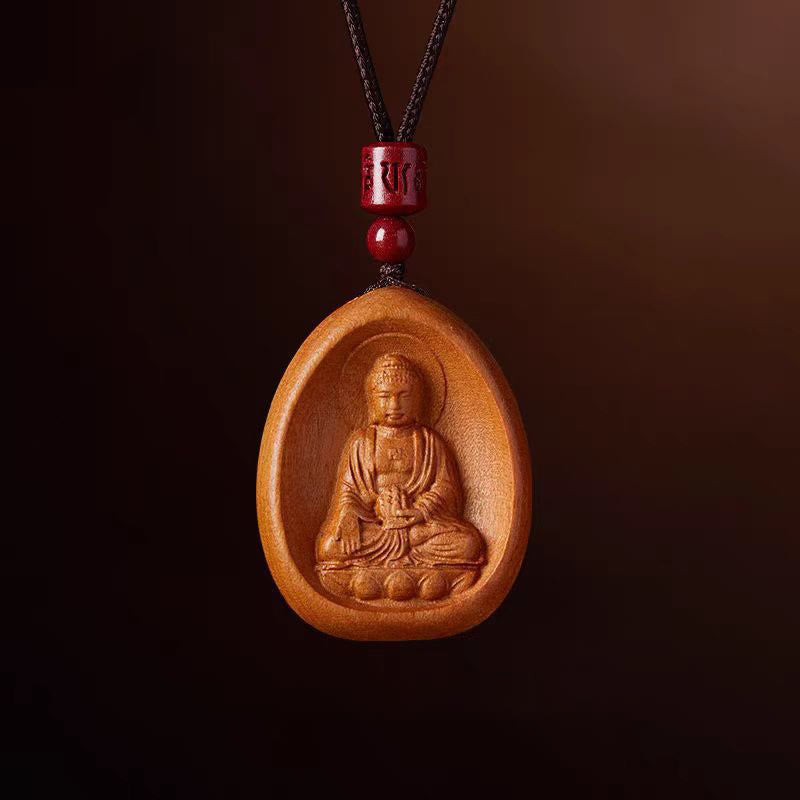 Kette Pfirsichholz mit Buddha Anhänger und roten Perlen