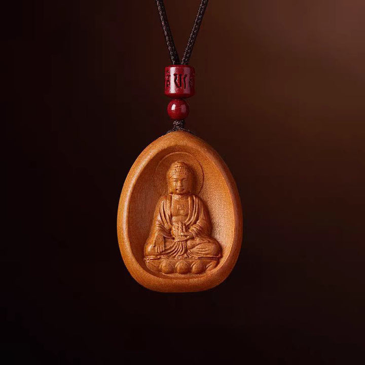 Kette Pfirsichholz mit Buddha Anhänger und roten Perlen