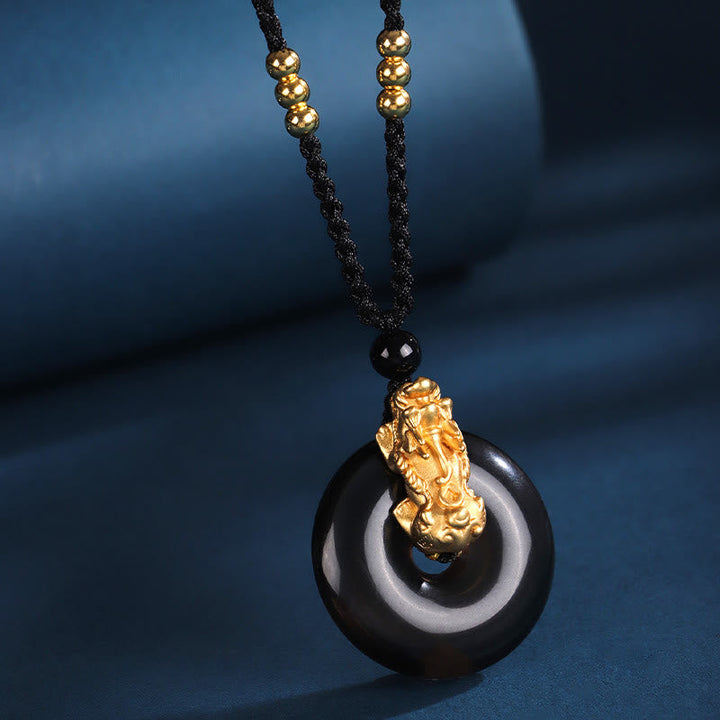 Schwarzonyx Kette mit Pixiu Anhänger Wohlstand goldfarbene Perlen