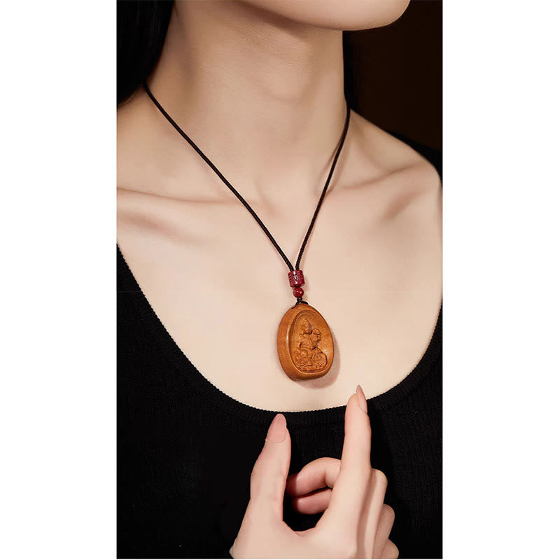Pfirsichholz Kette mit geschnitztem Buddha-Anhänger schwarze Kordel