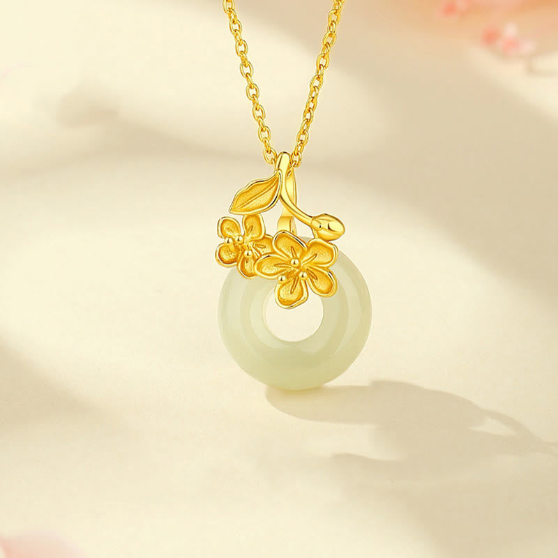 Jade Kette mit goldenen Blüten Anhänger eleganter Naturstein Schmuck