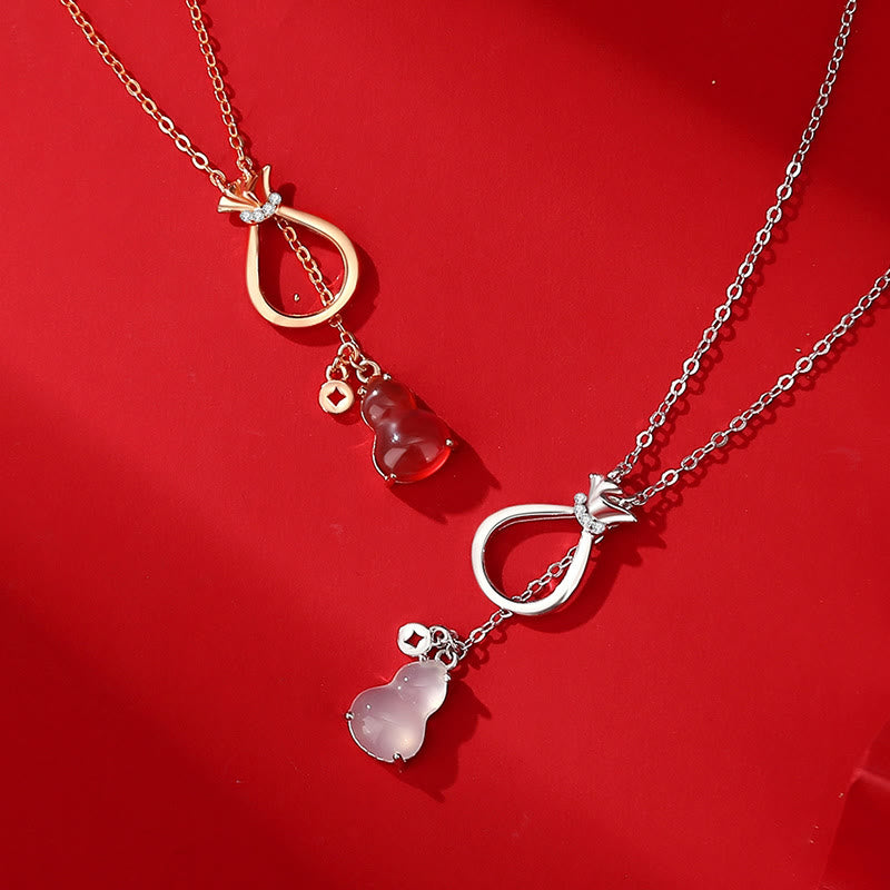Zwei Edelsteinketten Anhänger rot rosa Schmuck golden silbern Varianten