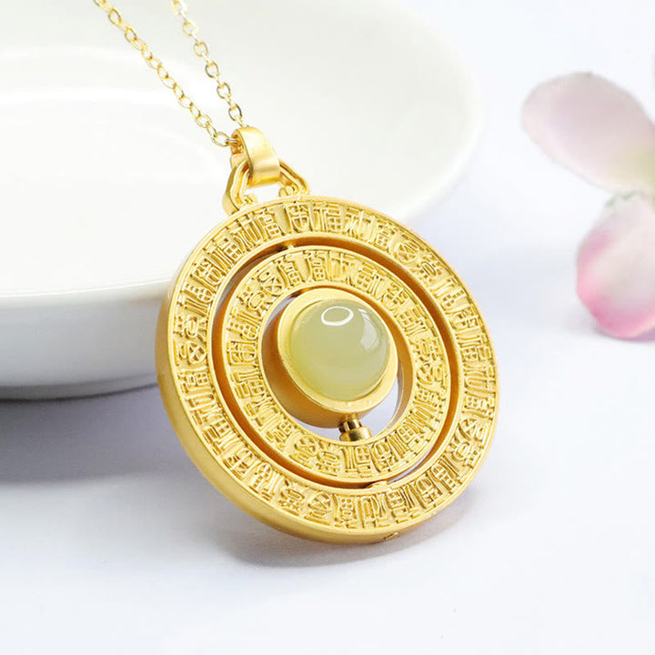 Goldener Anhänger Hetian Jade Fu-Zeichen Drehbar in rundem Gehäuse