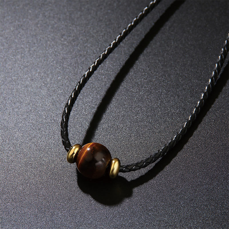 Kette Tigerauge braun Perlen goldene Metallakzente schwarzes Band