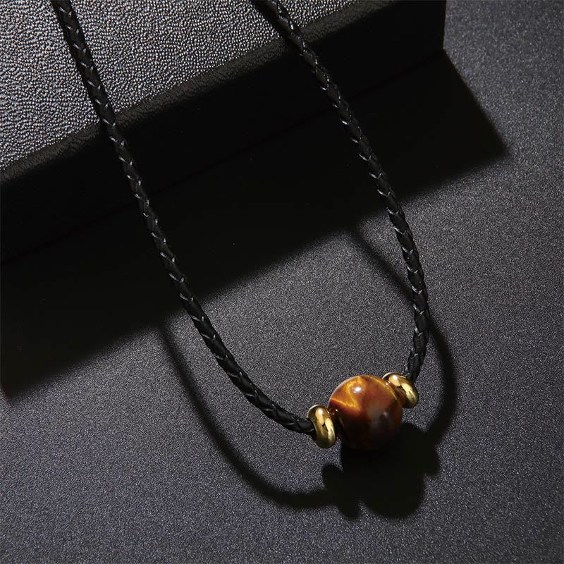 Tigerauge Kette mit schwarzer Schnur Schutzknoten goldene Perlen Naturstein