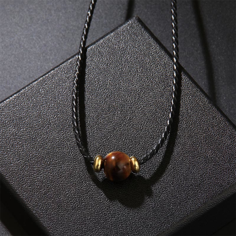 Tigerauge Schutz Kette braune Perle Naturstein Goldkappen schwarzes Band