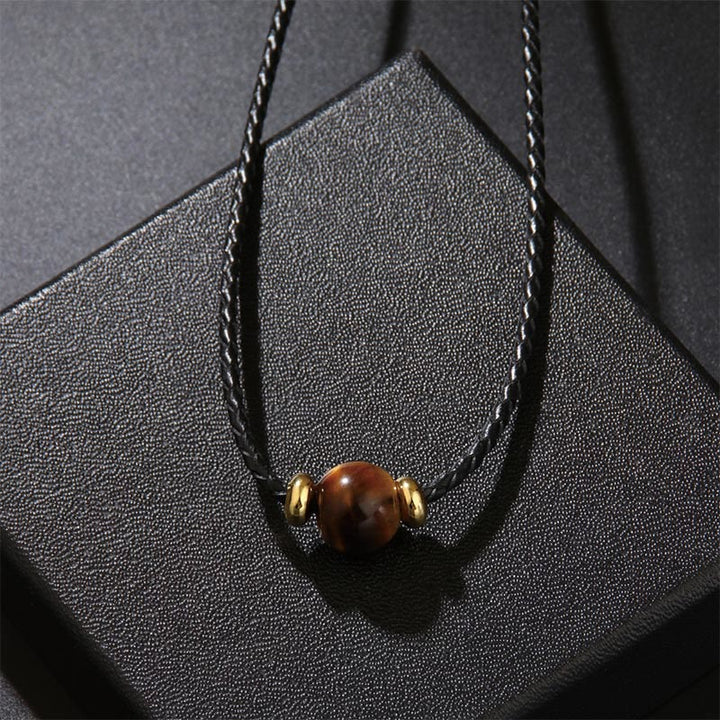 Tigerauge Schutz Kette braune Perle Naturstein Goldkappen schwarzes Band
