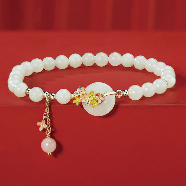 Hetian Jade Armband mit vergoldetem Osmanthusblüten-Anhänger und farbigen Zirkonia