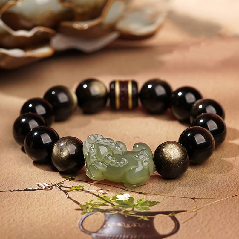 Armband mit schwarzen Obsidian Perlen und grüner Jade Pixiu Anhänger Wohlstand.