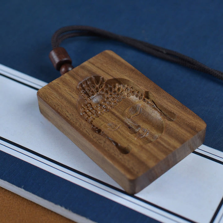 Braune Sandelholz Kette mit Buddha-Symbol Anhänger schwarzer Schnur