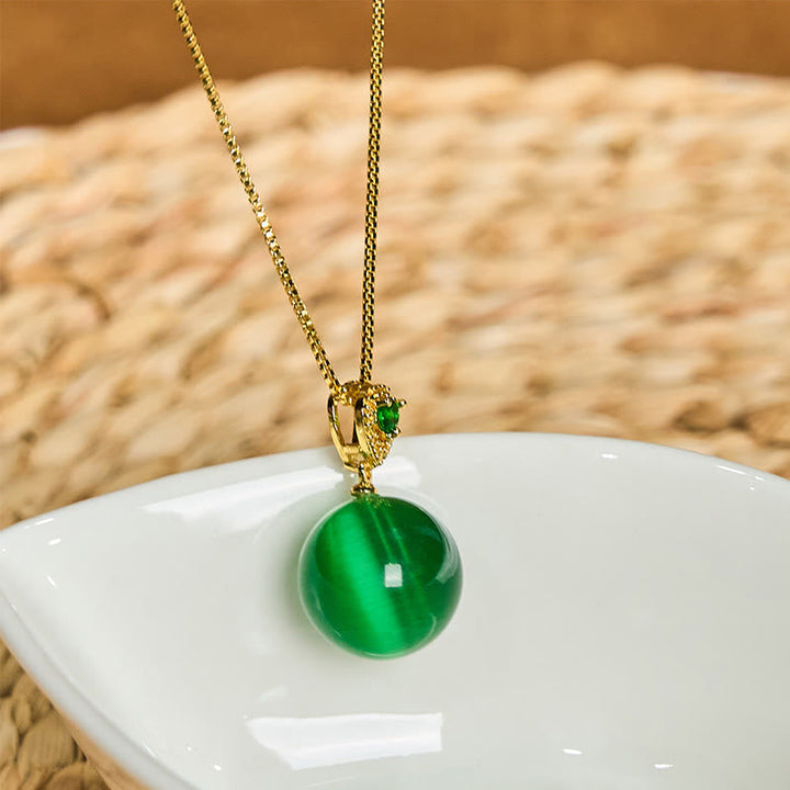Grüne Katzenauge Kette mit Buddha-Kugel Anhänger Gold Kettenglied