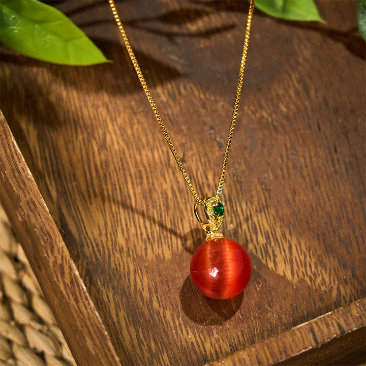 Goldene Kette mit roter Katzenauge Buddha-Kugel Anhänger