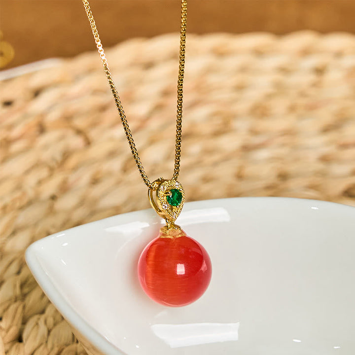 Rote Kette Katzenauge Buddha-Kugel Anhänger goldfarbenes Metall grüner Edelstein