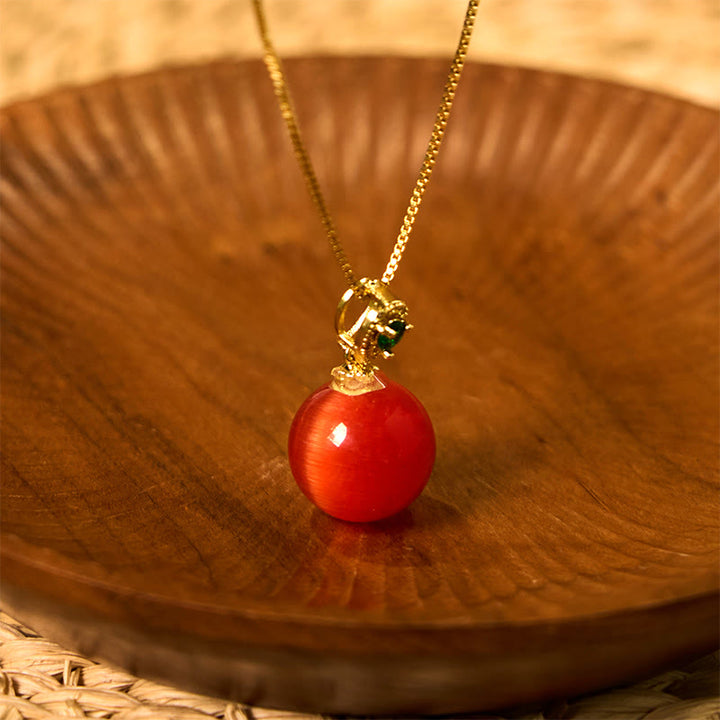 Rote Buddha-Kugel Kette mit Katzenauge Anhänger goldene Fassung