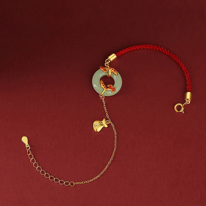 Armband 925 Silber weiße Jade Koi Fisch rotes Seil golden glänzend.