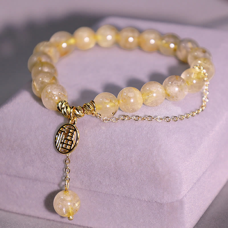 Armband Citrin Fu-Zeichen Glück goldene Perlen elastisch Handgelenk getragen