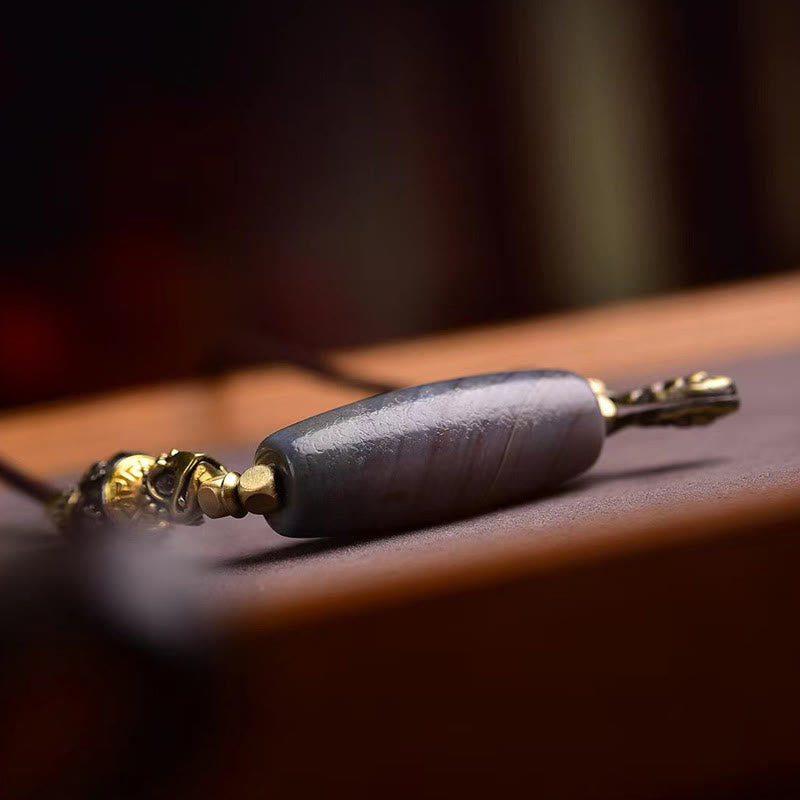 Schwarze Kette Tibet Dzi Anhänger mit goldenen Beschlägen Naturstein Schutz