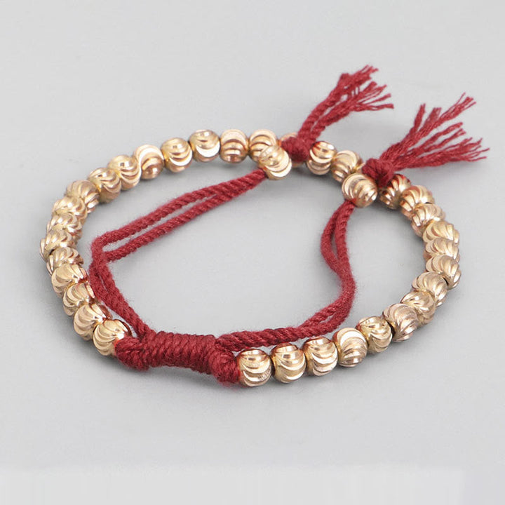 Armband Kupfer – Glück Balance rote Schnur goldene Perlen elastisch.